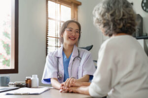 Doctor talking with elderly woman